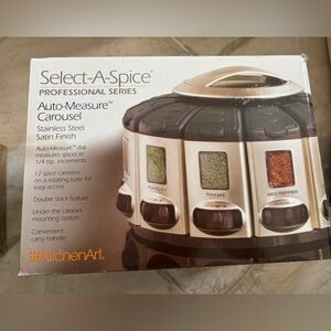 12 spice canisters arranged on a rotating base for easy access.  ￼